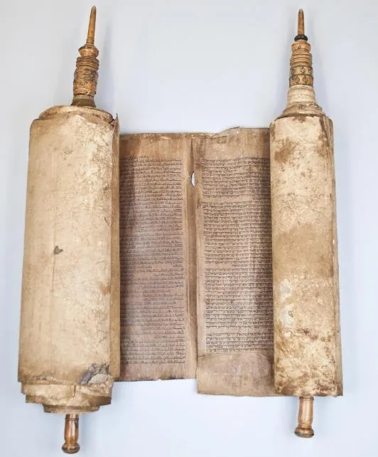 Torah scroll open on two wooden rollers, replica of the original in the Sephardic Museum of Toledo