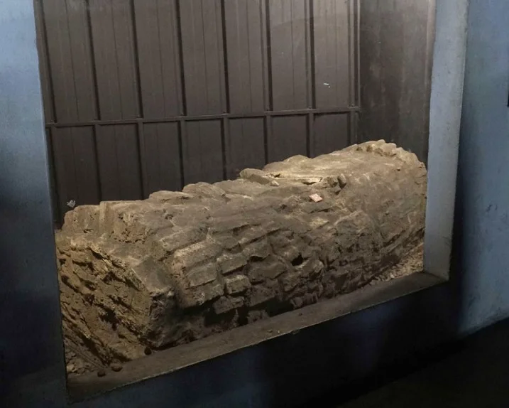 Brick tomb from the old Jewish cemetery, on display on the basement level of the Cano y Cueto car park